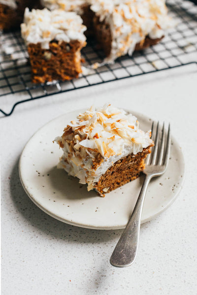 A simple vegan carrot cake with orange and cardamon and a maple sweetened coconut icing